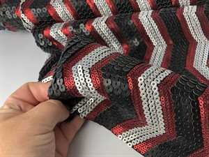 Pailletstof - zigzag mønster i i røde / sorte / grå toner